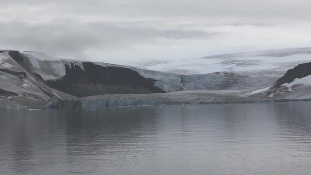 Harsh Arctic. Old trough glacier on Payer island (outlet glacier, glacial ablation,  ice front). Franz-Joseph Land.
