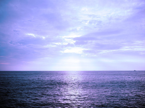 Fototapeta Ocean at sunset with blue filter effected