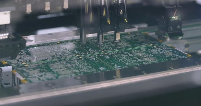 Surface Mount Technology (Smt) Machine places elements on circuit boards