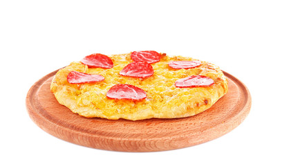 Tasty pizza on wooden board and white background