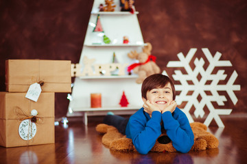 smiling  boy  in the studio with Christmas decorations