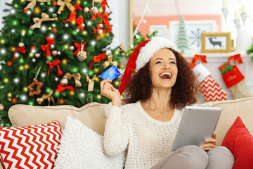 Young woman ordering Christmas gifts online