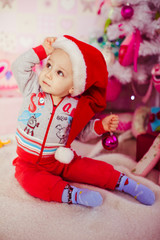 Baby boy with Santa Claus-hat in his head