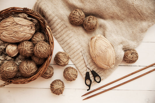 yarns for knitting on a wooden table