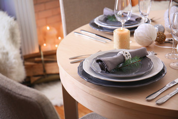 Table served for Christmas dinner in living room, close up view