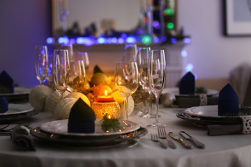Table served for Christmas dinner in living room, close up view