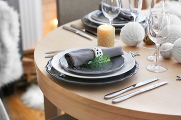 Table served for Christmas dinner in living room, close up view