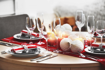 Table served for Christmas dinner in living room, close up view