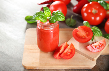 Glass jar with fresh vegetable smoothie on wooden table