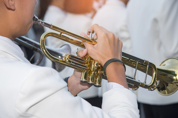 Obraz na płótnie Canvas Closeup of trumpet player's hands , Marching Band