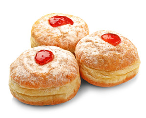 Tasty donuts with jam on white background. Hanukkah celebration concept