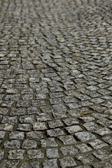 Wet cobblestone pavement after the rain.