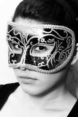 Beautiful incognito woman wearing a carnival venetian mask