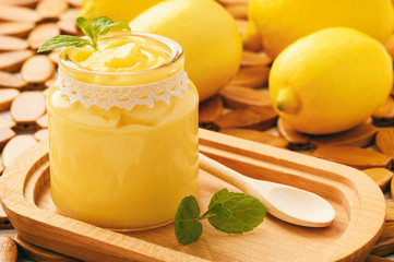 Lemon curd (english citrus cream) in glass jars