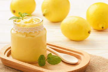 Lemon curd (english citrus cream) in glass jars