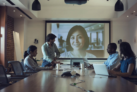 Business people having a video conference in board room