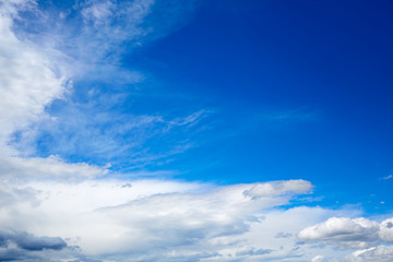 Naklejka na ściany i meble Blue sky with white clouds in a summer day