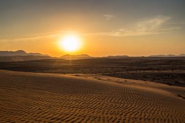 Sunset over the Wahiba Sands desert, Oman.