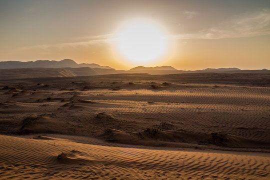 Sunset over the Wahiba Sands desert, Oman.