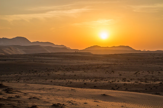 Sunset over the Wahiba Sands desert, Oman. © louiserussell77