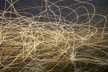 Abstract background with rays of light on black