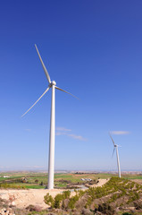 Huge windmill station with blue sky background