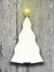 Single blank Christmas tree frame supported by clip against gray wooden boards background