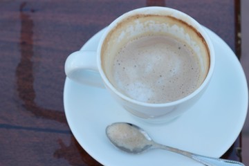 Coffee espresso in cup on wood background.