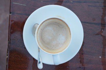 Obraz na płótnie Canvas Coffee espresso in cup on wood background.