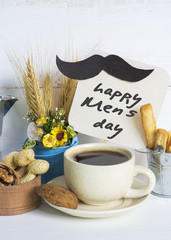special breakfast note with a mustache a cup of coffee on wooden table. Sun-filter effect toned Image. 