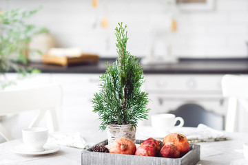 rustic modern christmas served table with fruits and cup of tea. (New Year) a table for dinner..