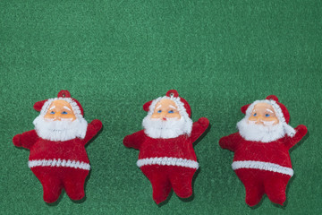 Merry Christmas and Happy New Year,
Santa Claus on green background