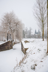 Old city gate in winter city park