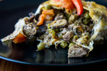 Turkish Bohca Kebab / Crepe with Cubed Meatball and Vegetables.