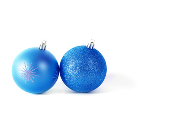 Two blue Christmas balls isolated on white