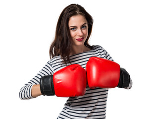 Pretty young girl with boxing gloves
