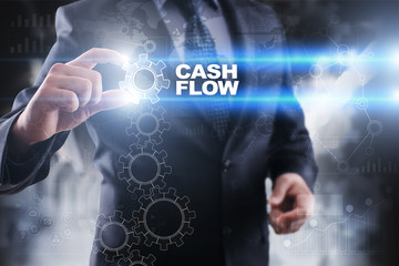 Businessman selecting cash flow on virtual screen.