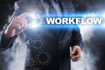 Businessman selecting workflow on virtual screen.