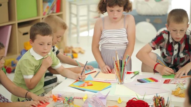 Group of Preschoolers Drawing at the Kindergarten
