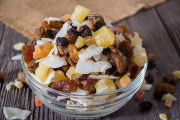 Nuts and dried fruits on wooden background