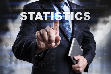 Businessman is pressing button on touch screen interface and selecting statistics.