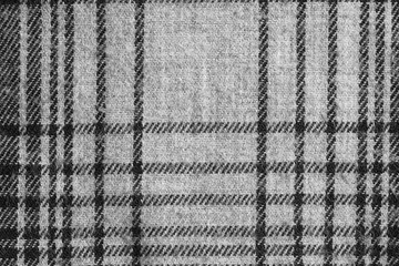 Texture of grey checkered fabric. Cotton fabric close-up.