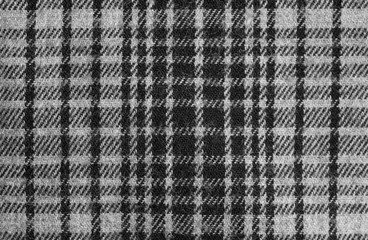 Texture of grey checkered fabric. Cotton fabric close-up.