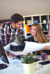 Couple of web designers working together at modern office