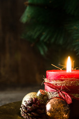 Red Christmas candle and Christmas ornaments
