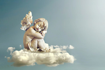 Angel sleeping on the cloud