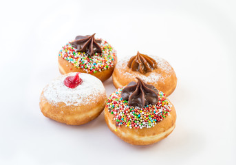 Fresh donuts with jelly and chocolate for Hanukkah celebration. Selective focus.