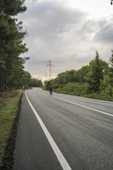 Fototapeta premium A man riding bike on road