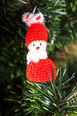 Knitted toy on Christmas tree