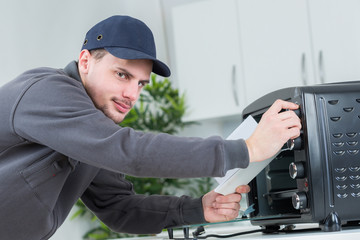 Man setting up appliance